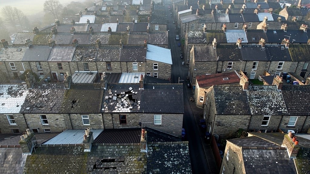Aerial view showing Yorkshire terraced house rooflines and chimney stacks